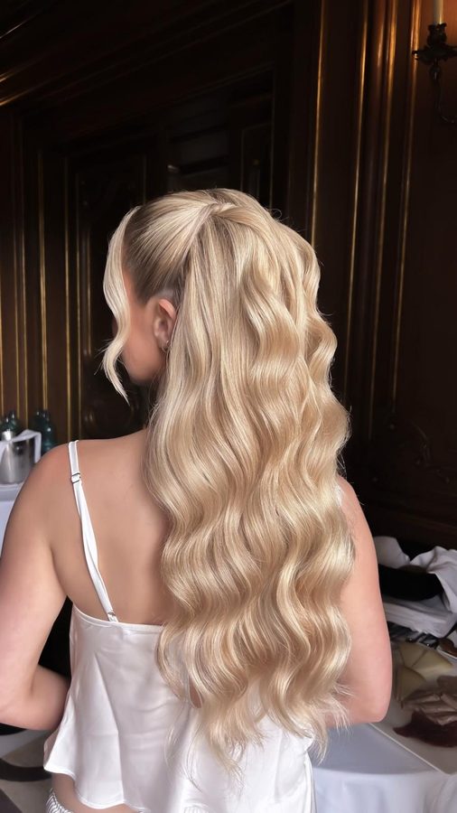 Blonde half-up ponytail with soft waves