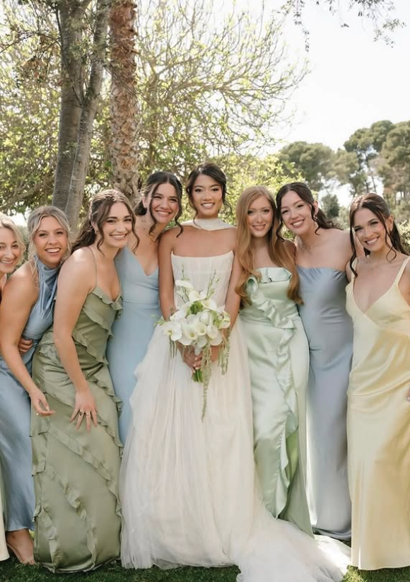 Bride and bridesmaids in pastel dresses