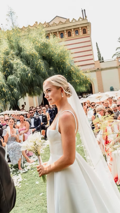 Bride walking down the ceremony aisle