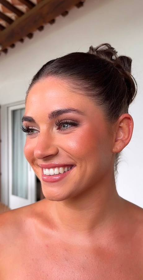 Bride with soft messy bun and glowing skin