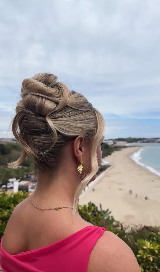 Textured bridal updo with beach backdrop