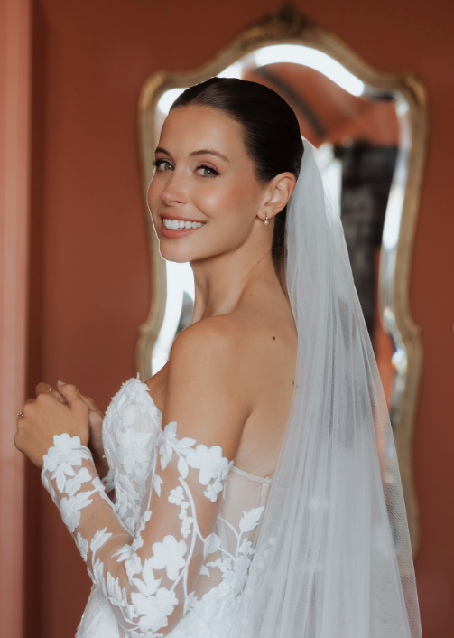 Bride with veil and ornate gold mirror